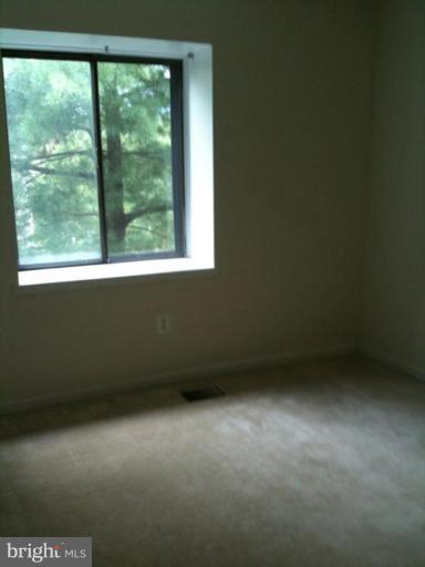 7922 Spring Forest Court, Unit 4A Springfield, VA 22152 - Photo 7 of 12 a view of an empty room with a window