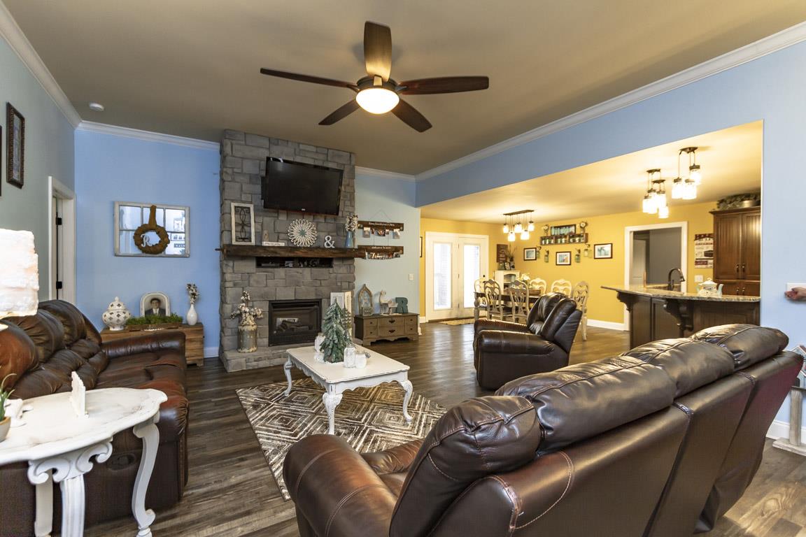231 Calvert Ridge Road Westmoreland, TN 37186 - Photo 3 of 27 a living room with furniture a flat screen tv and kitchen view