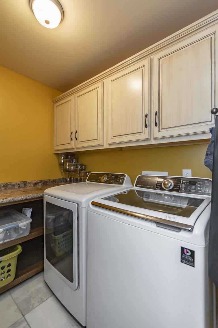 231 Calvert Ridge Road Westmoreland, TN 37186 - Photo 21 of 27 a kitchen with stainless steel appliances granite countertop a stove and a white cabinets