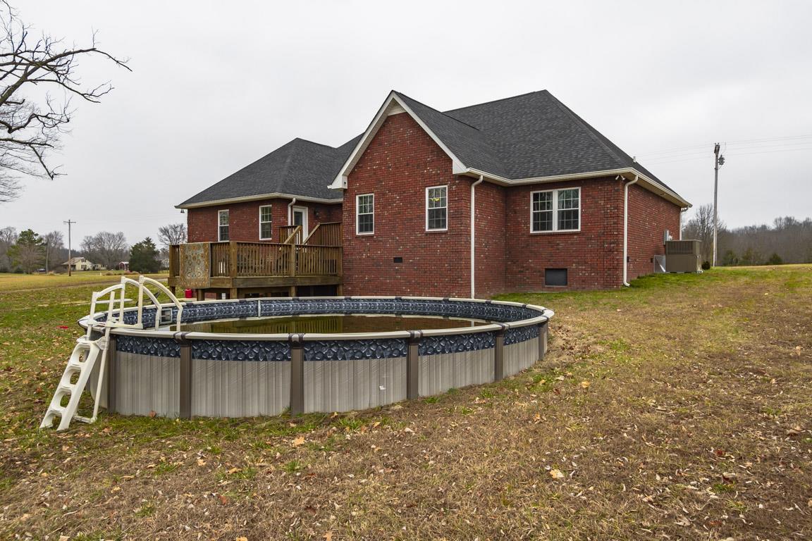 231 Calvert Ridge Road Westmoreland, TN 37186 - Photo 25 of 27 a view of a house with a yard and a large tree