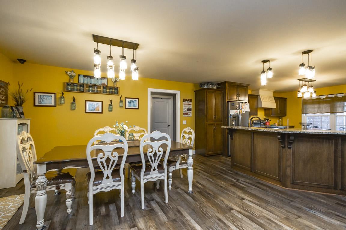 231 Calvert Ridge Road Westmoreland, TN 37186 - Photo 6 of 27 a view of a dining room with furniture and wooden floor