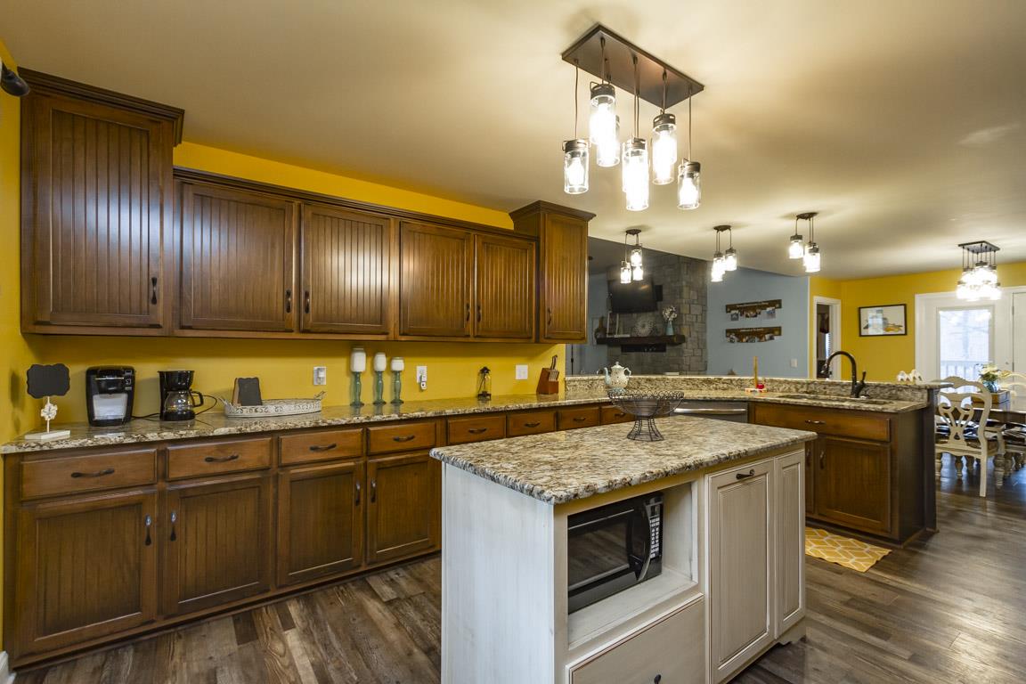 231 Calvert Ridge Road Westmoreland, TN 37186 - Photo 7 of 27 a kitchen with a sink and stove