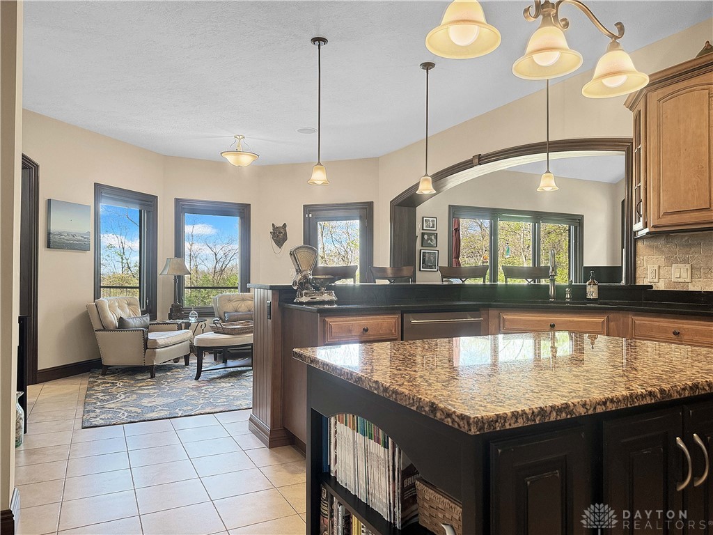 4096 Middle Urbana Road Urbana, OH 43078 - Photo 19 of 96 This open kitchen and breakfast area feature a kitchen island, recessed lighting, and large windows.