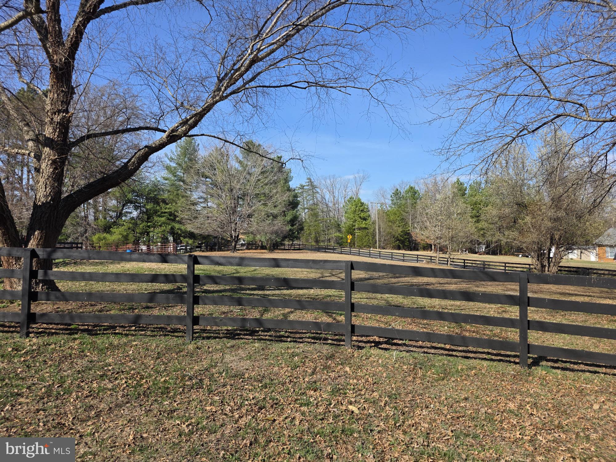 10122 Elys Ford Road Fredericksburg, VA 22407 - Photo 8 of 89 Serene countryside with rustic fencing.
