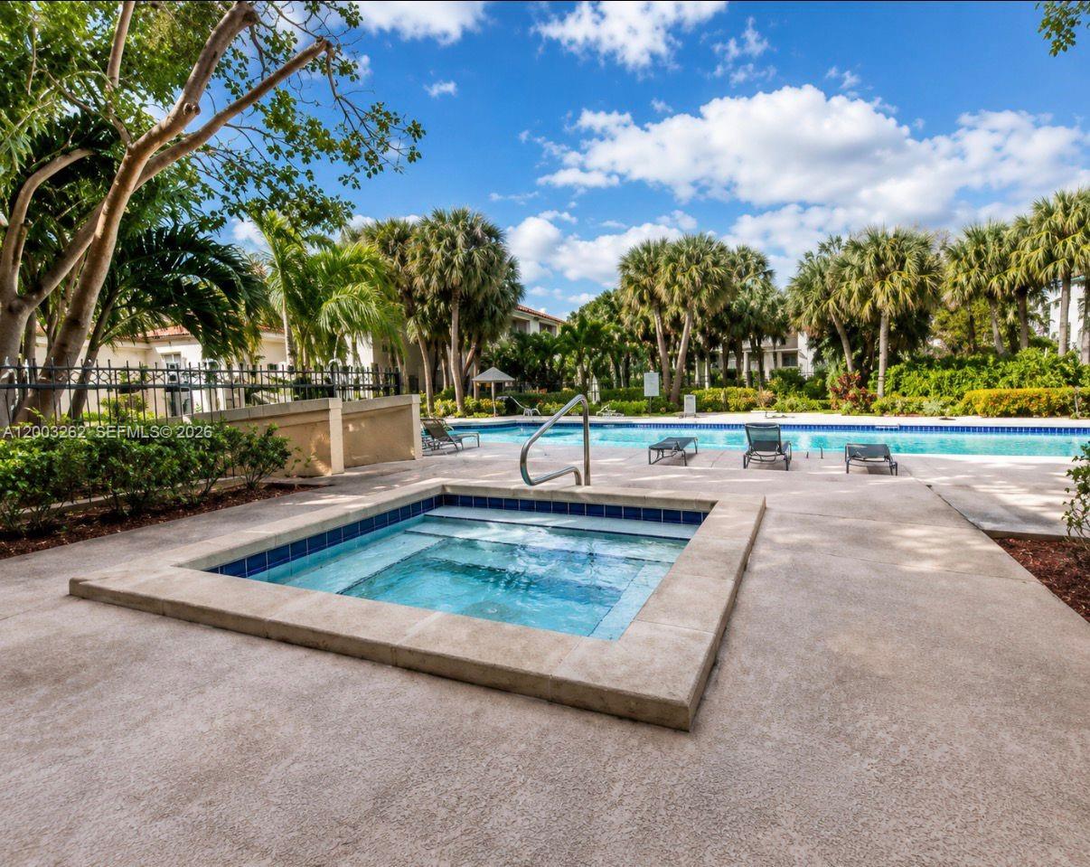 620 South Park Road, Unit 312 Hollywood, FL 33021 - Photo 10 of 14 front view of a house with a yard and trees