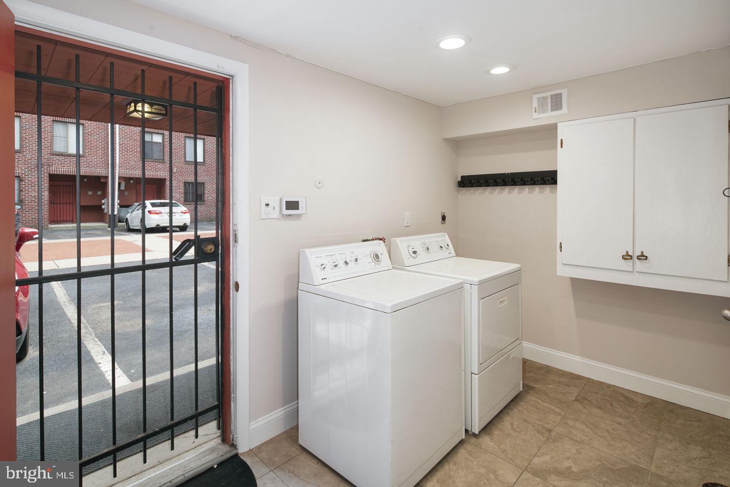 802 Pine Street, Unit A Philadelphia, PA 19147 - Photo 25 of 37 Laundry, Rear Entrance, and Parking Spot in View.