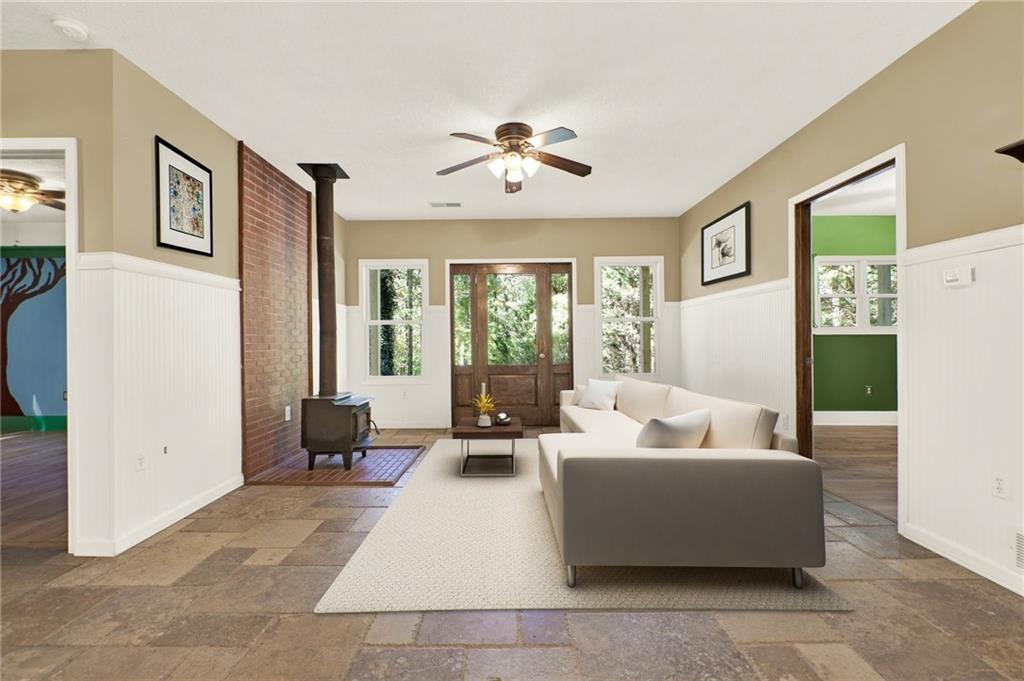 438 East Price Creek Road Jasper, GA 30143 - Photo 11 of 64 a living room with furniture and a large window