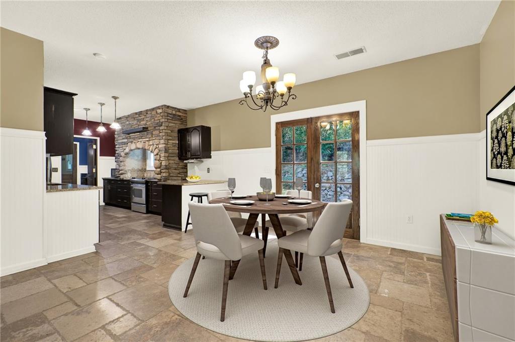 438 East Price Creek Road Jasper, GA 30143 - Photo 13 of 64 a view of a dining room with furniture and a chandelier