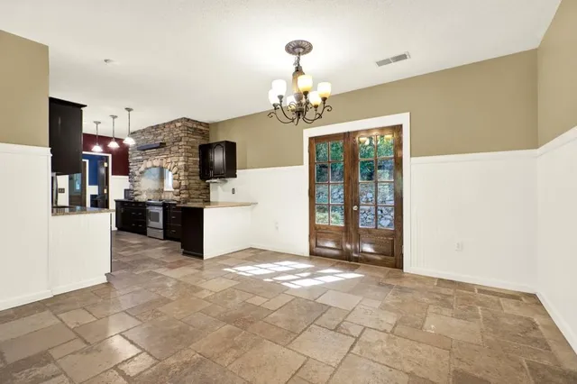 a big yard with lots of green space and deers