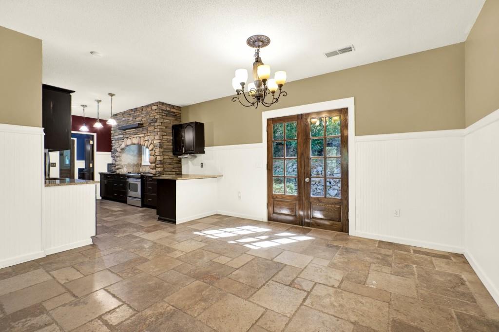 438 East Price Creek Road Jasper, GA 30143 - Photo 14 of 64 a view of a kitchen with granite countertop cabinets and a stove