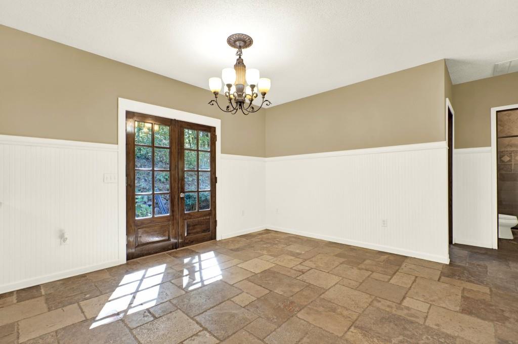 438 East Price Creek Road Jasper, GA 30143 - Photo 16 of 64 a view of a big room with windows and chandelier