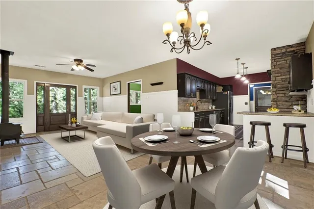 a kitchen with stainless steel appliances granite countertop a sink and a stove