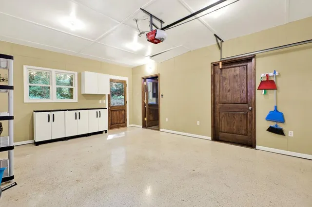 a bathroom with a sink a vanity and a bathtub