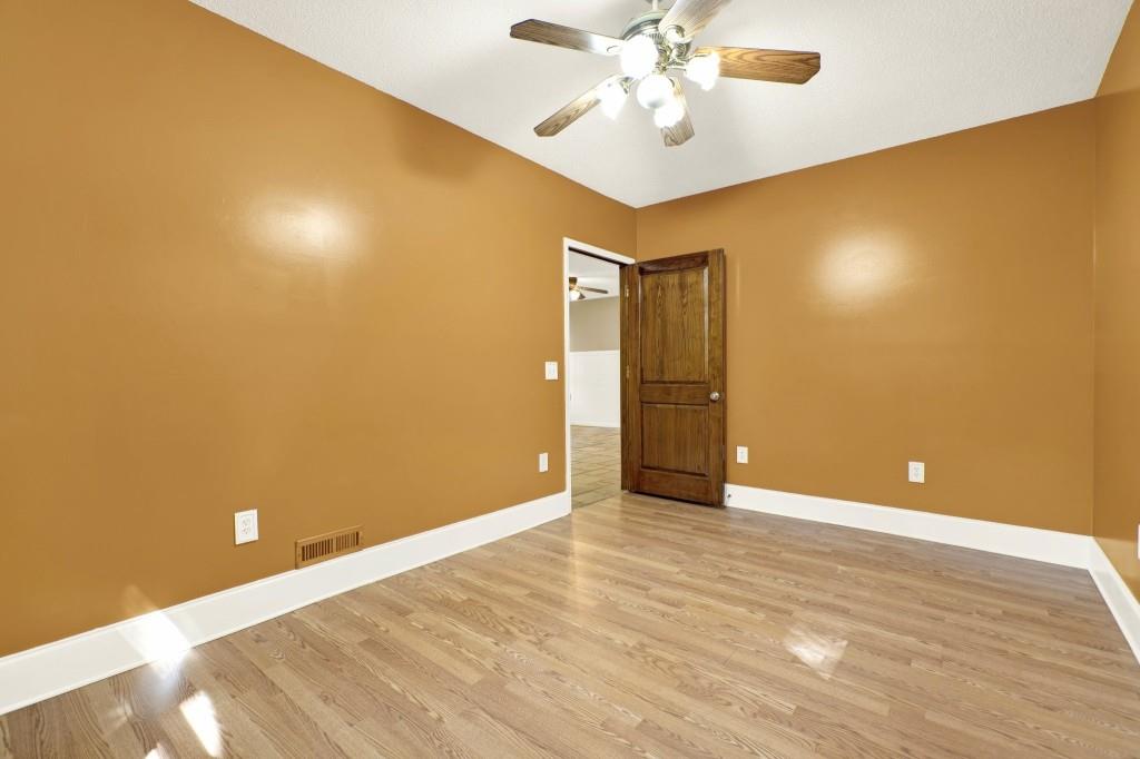 438 East Price Creek Road Jasper, GA 30143 - Photo 39 of 64 a view of an empty room with wooden floor