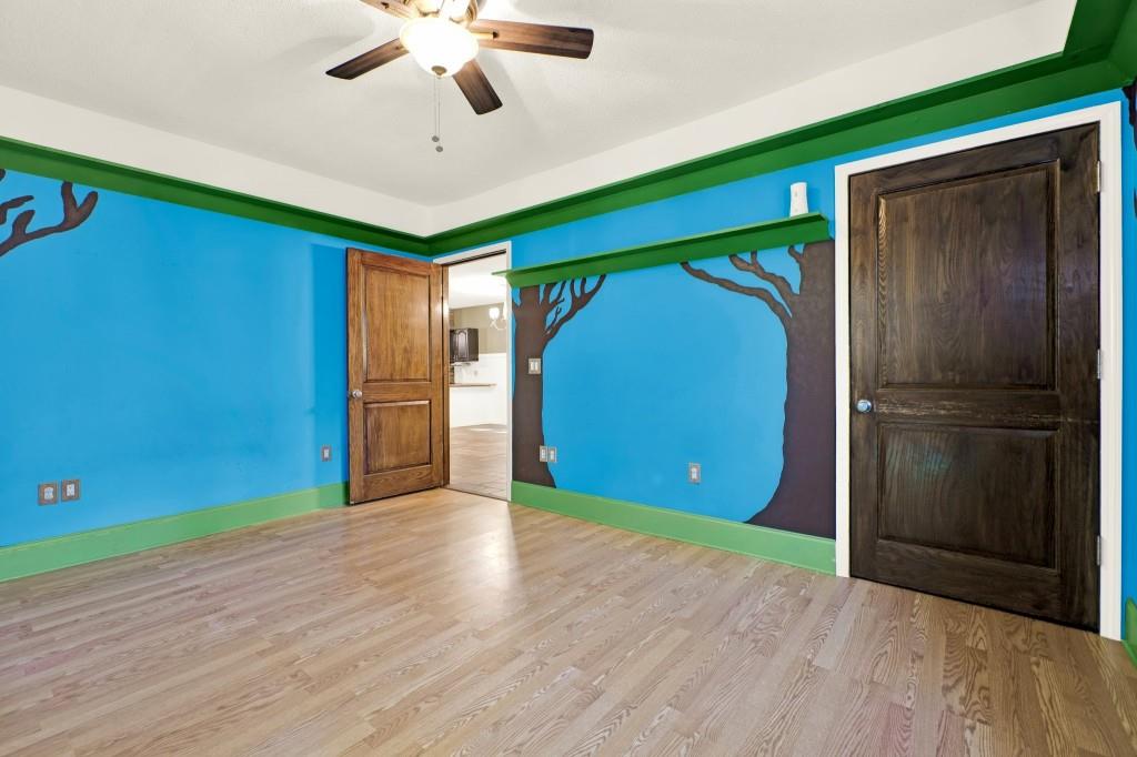 438 East Price Creek Road Jasper, GA 30143 - Photo 41 of 64 a view of a livingroom with wooden floor and a ceiling fan