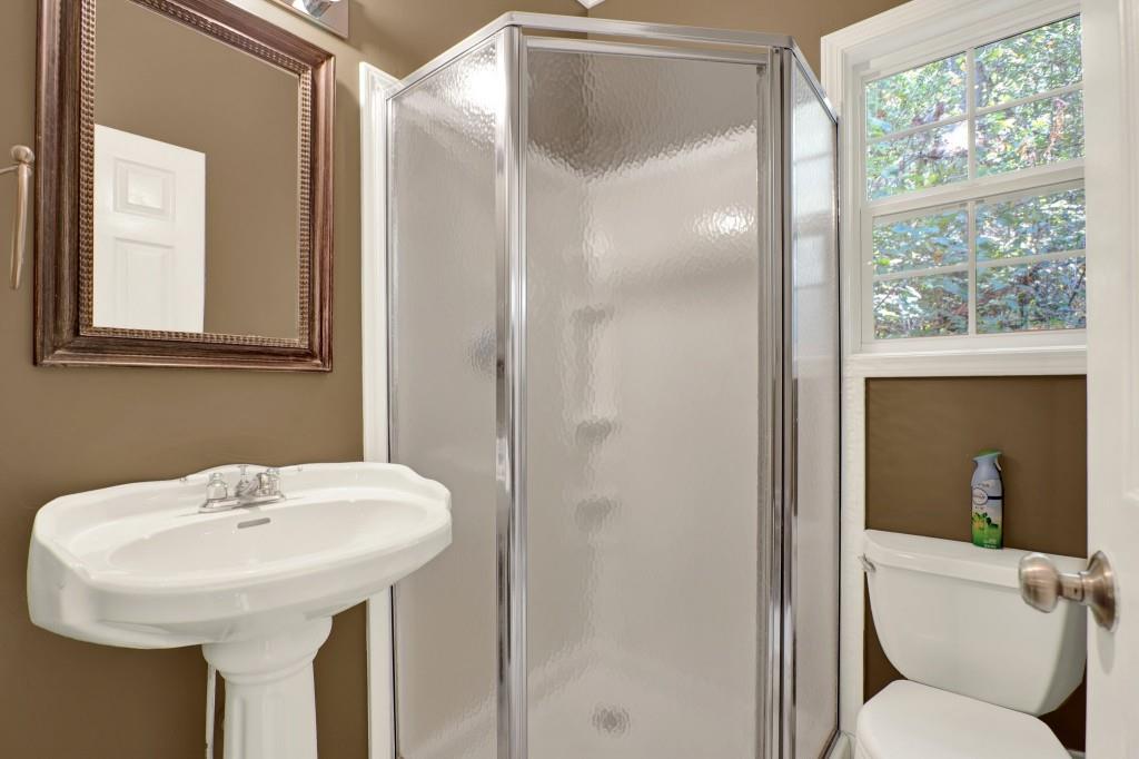 438 East Price Creek Road Jasper, GA 30143 - Photo 53 of 64 a bathroom with a sink toilet and a mirror