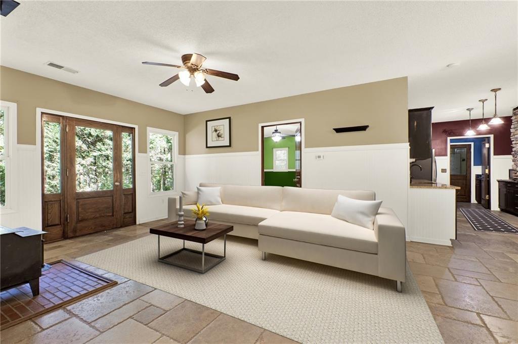 438 East Price Creek Road Jasper, GA 30143 - Photo 8 of 64 a living room with furniture and a chandelier