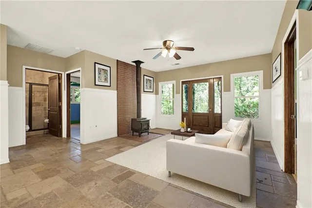a view of a dining room with furniture and a chandelier