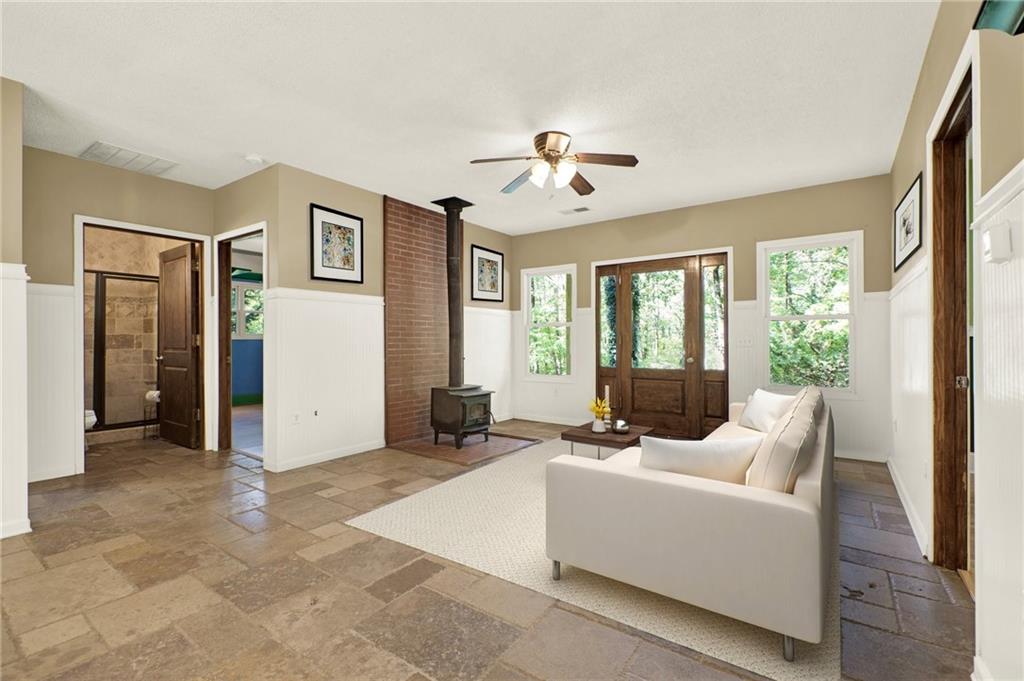438 East Price Creek Road Jasper, GA 30143 - Photo 10 of 64 a living room with furniture and large windows