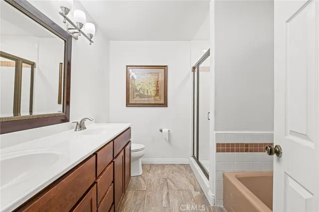 a bathroom with a sink a vanity and a large mirror