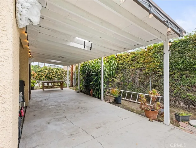 a view of a backyard with sitting area