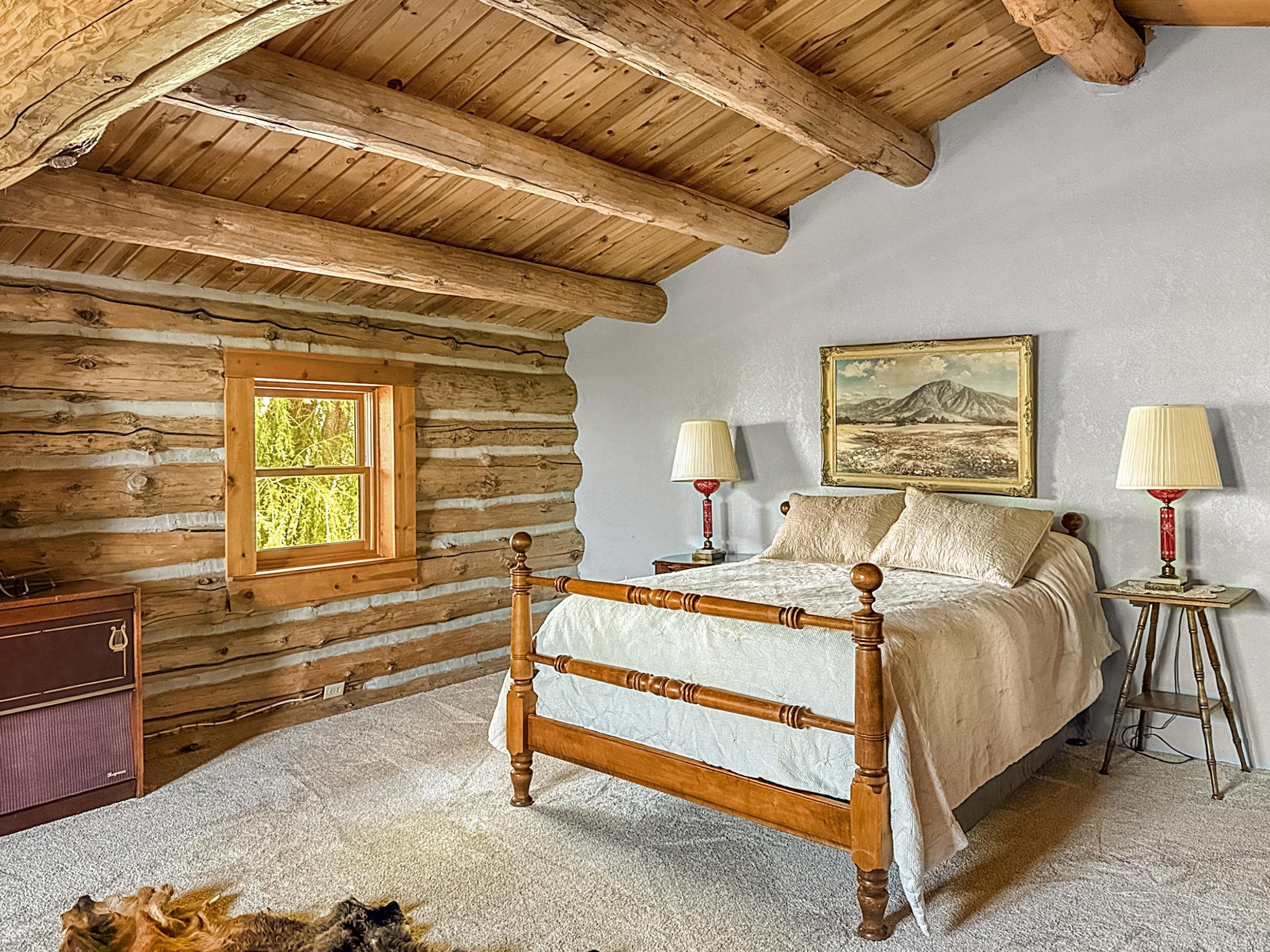 9709 3605 Road Hotchkiss, CO 81419 - Photo 31 of 42 a bedroom with a bed and a night stand