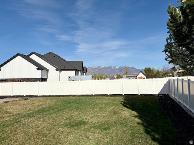 3359 Eurasian Crane Road Clinton, UT 84015 - Photo 63 of 71 Fenced backyard featuring a mountain view