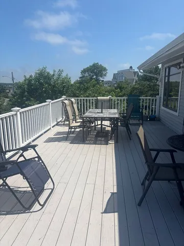 a view of roof deck with patio