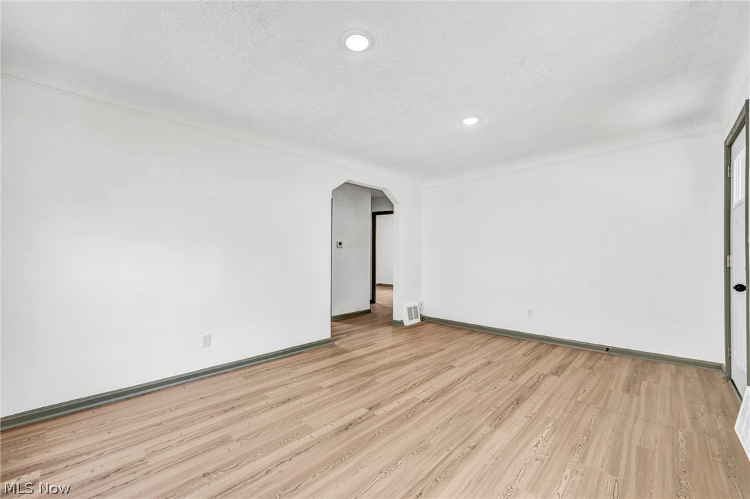 1609 Mapledale Road Wickliffe, OH 44092 - Photo 9 of 46 Unfurnished room featuring a textured ceiling and light wood-type flooring