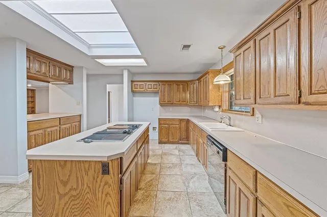 a kitchen with stainless steel appliances granite countertop a sink and cabinets