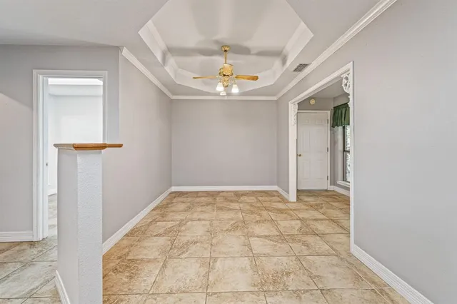 an empty room with entrance and mirror