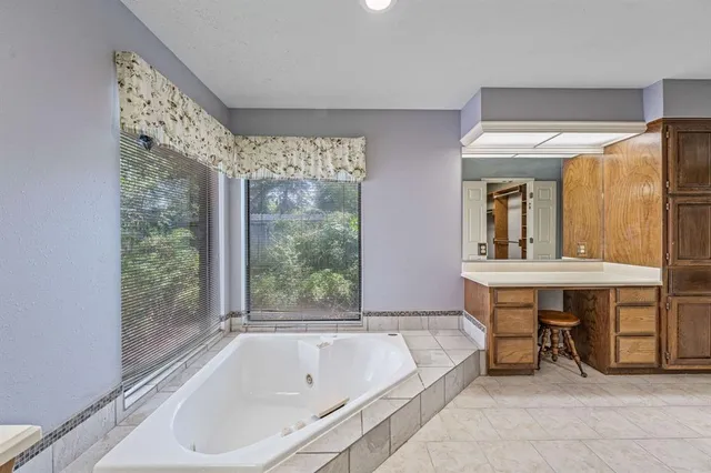 a bathroom with a bathtub and a sink