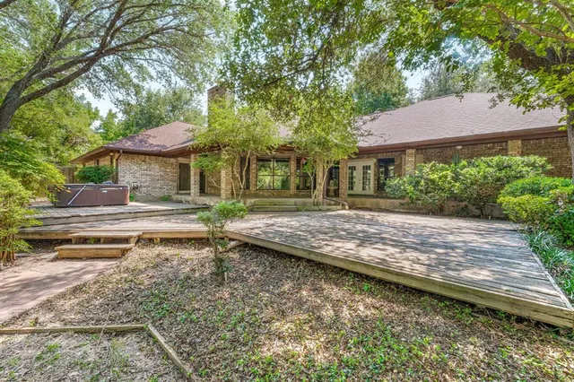 a view of a house with a yard porch and sitting area