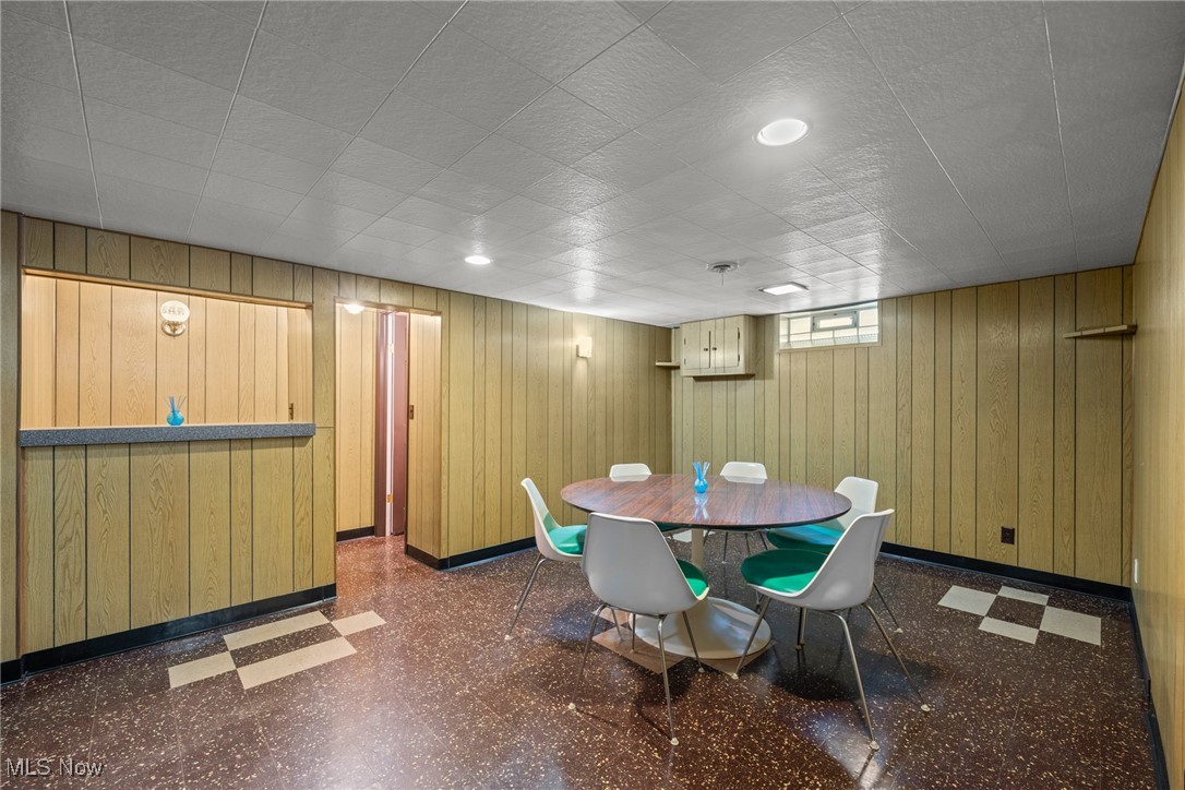 29776 Arthur Road Wickliffe, OH 44092 - Photo 29 of 49 Dining space featuring tile patterned floors and wooden walls