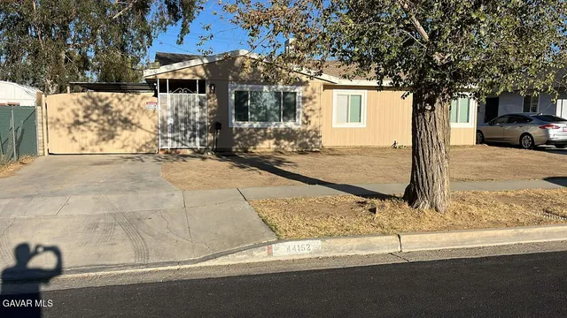 a house with trees in front of it