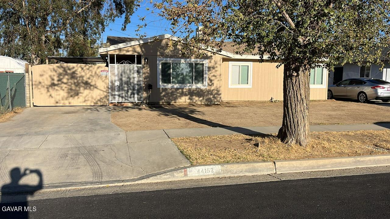 44152 Elm Avenue Lancaster, CA 93534 - Photo 11 of 17 a house with trees in front of it