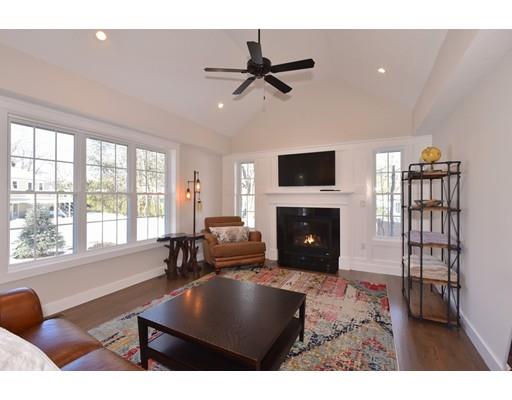 29 Brookdale Road Natick, MA 01760 - Photo 11 of 30 a living room with furniture a fireplace and a flat screen tv