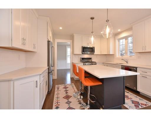 29 Brookdale Road Natick, MA 01760 - Photo 6 of 30 a kitchen with stainless steel appliances kitchen island a sink a stove a refrigerator and cabinets