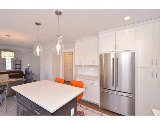 29 Brookdale Road Natick, MA 01760 - Photo 8 of 30 a kitchen with stainless steel appliances a refrigerator sink and microwave