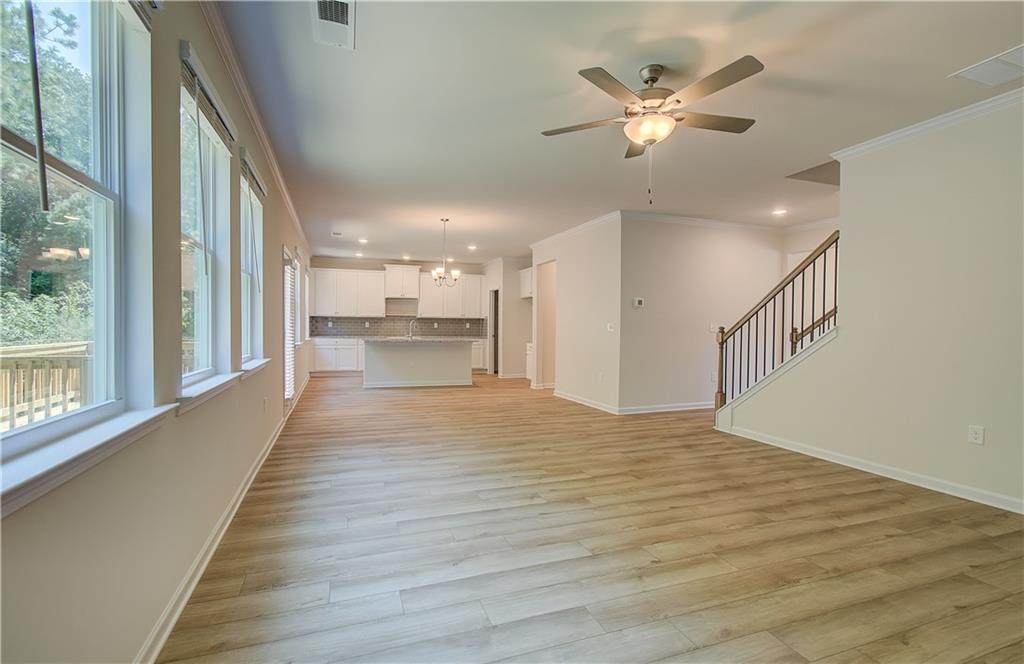 4501 Ajo Walk Atlanta, GA 30331 - Photo 14 of 16 a view of an empty room with wooden floor and a window