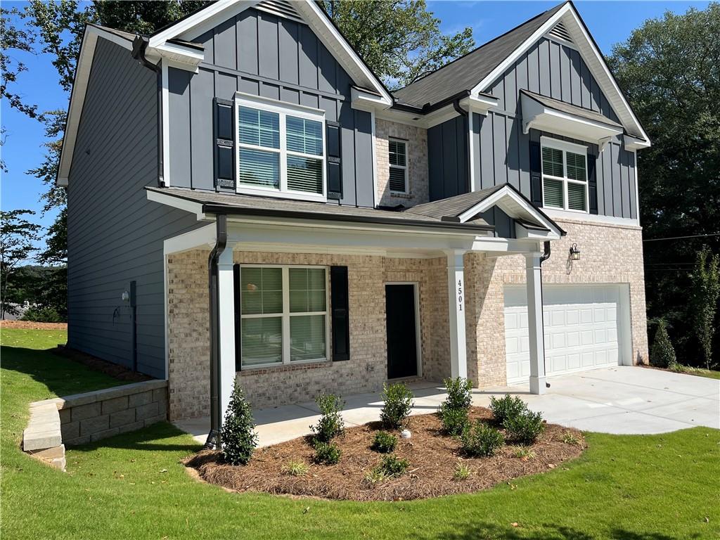4501 Ajo Walk Atlanta, GA 30331 - Photo 2 of 16 a front view of a house with a yard