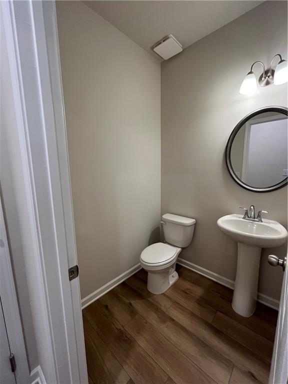 4501 Ajo Walk Atlanta, GA 30331 - Photo 4 of 16 a bathroom with a sink toilet and a mirror