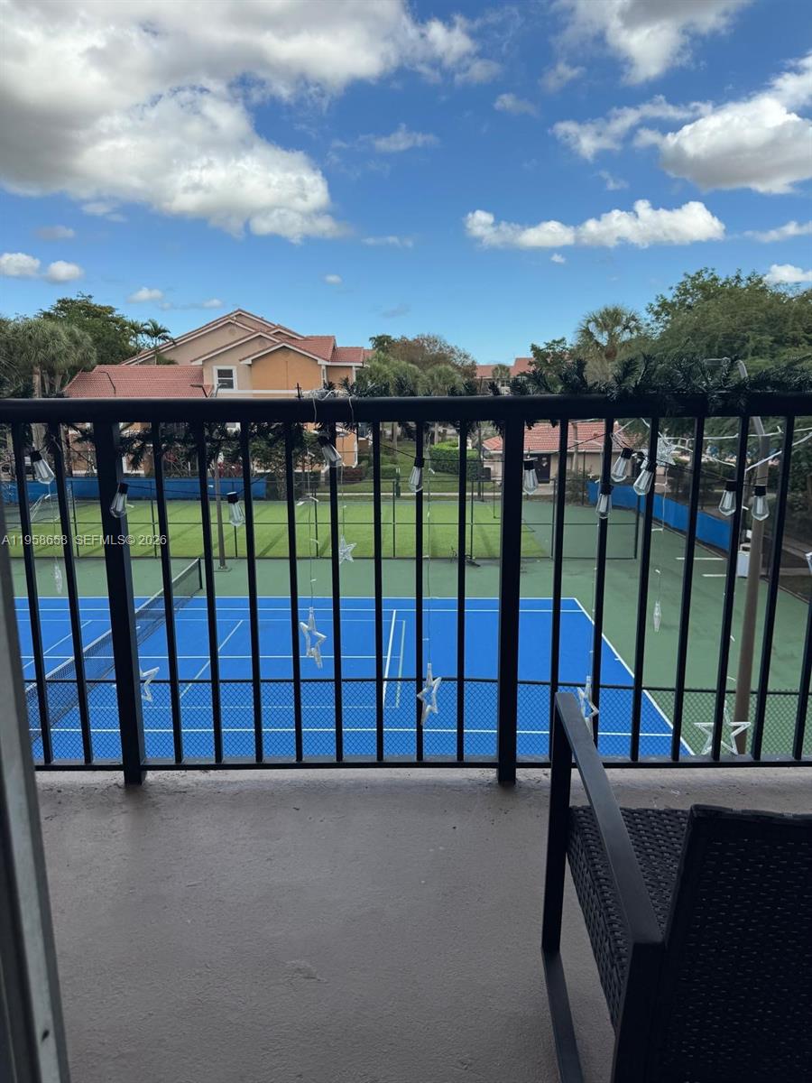 8801 Wiles Road, Unit 308 Coral Springs, FL 33067 - Photo 13 of 16 a view of balcony with furniture