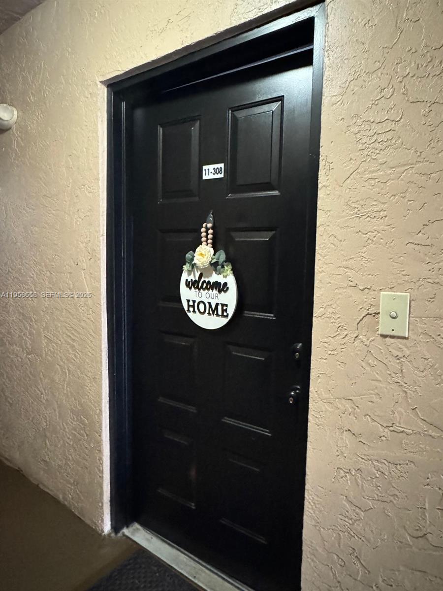 8801 Wiles Road, Unit 308 Coral Springs, FL 33067 - Photo 15 of 16 a view of a door of the house