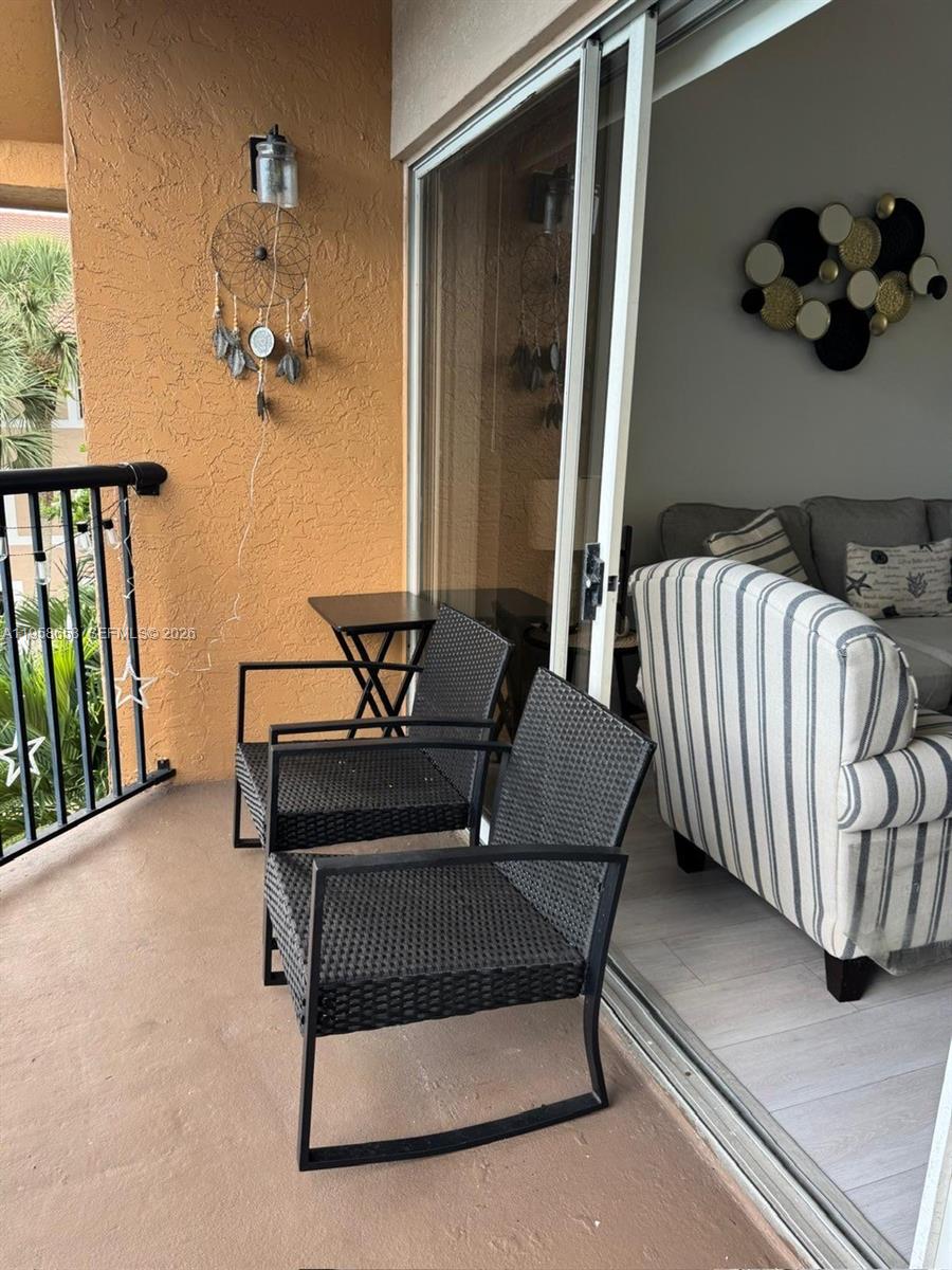 8801 Wiles Road, Unit 308 Coral Springs, FL 33067 - Photo 10 of 16 a living room with a couch