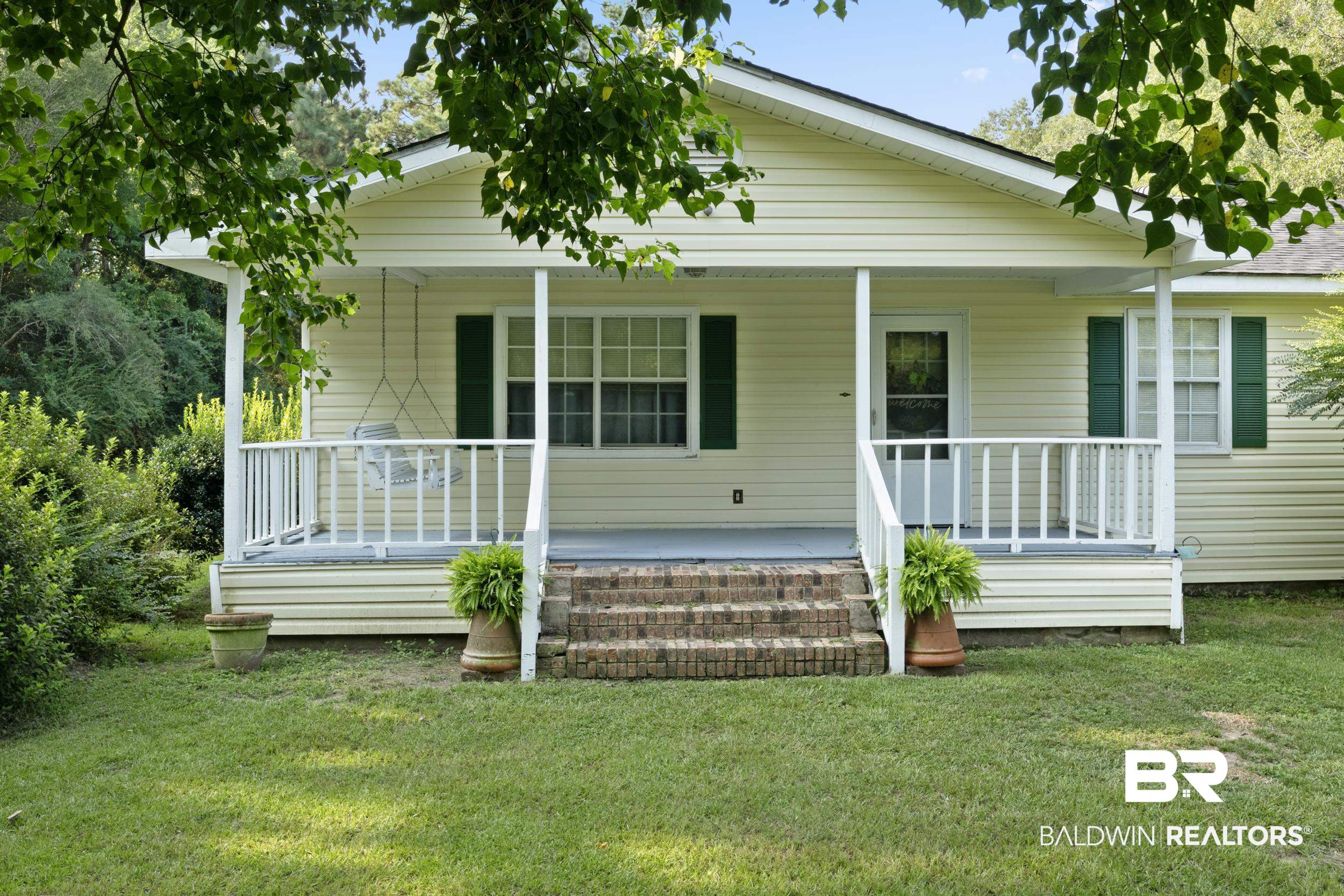 8701 A Rosemary Road Eight Mile, AL 36613 - Photo 2 of 27 Bungalow-style home featuring a front yard and a porch