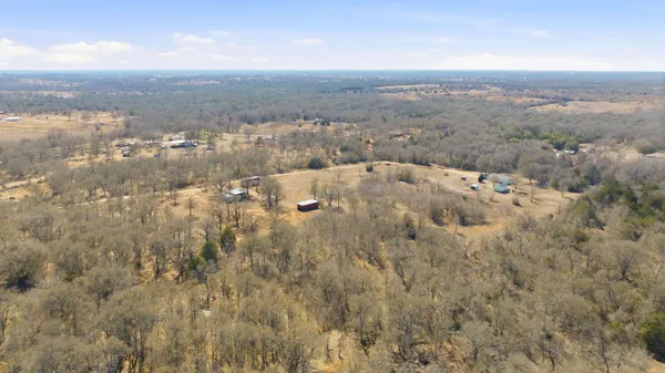 an aerial view of houses with city view