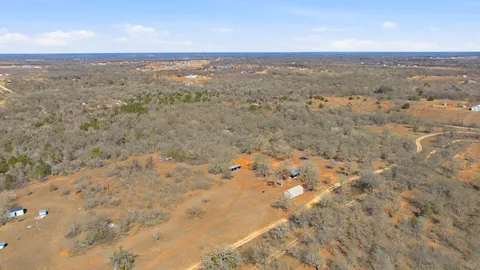 a view of yard covered with snow