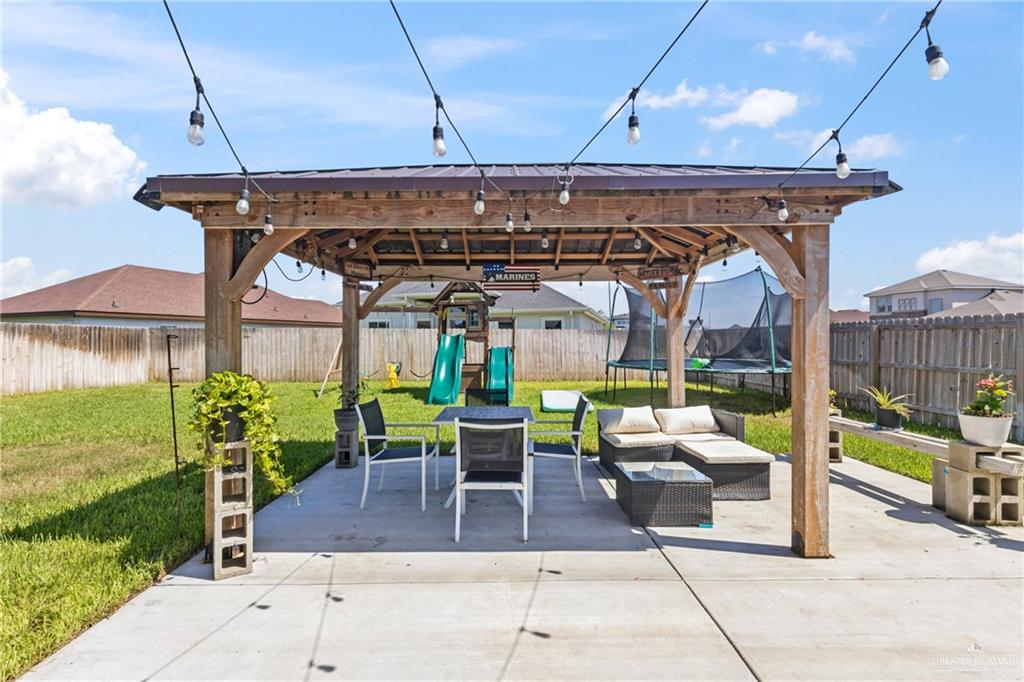 1904 Ridgeway Circle Edinburg, TX 78542 - Photo 26 of 32 Expansive outdoor patio featuring a wood pergola with string lighting