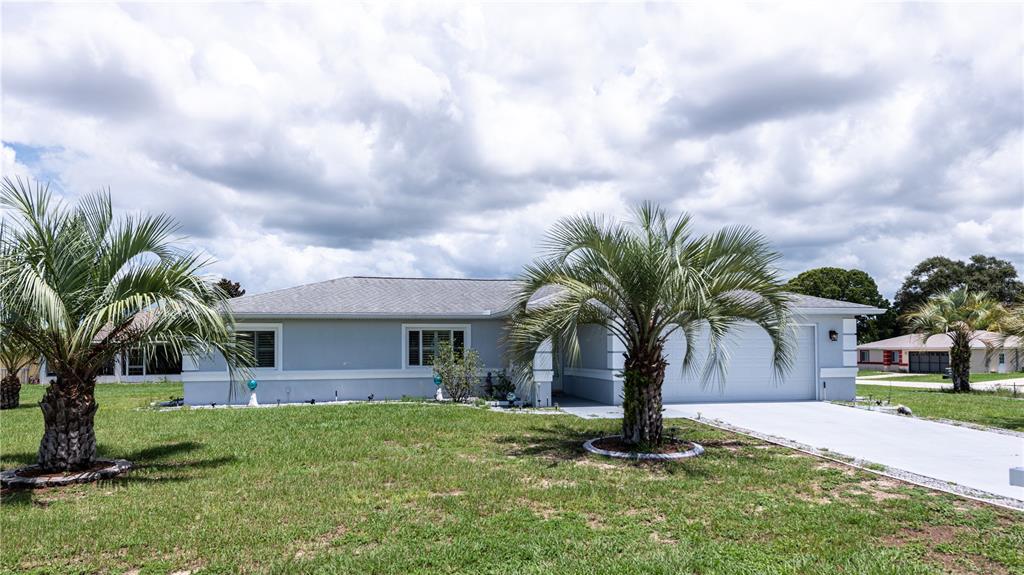 6063 Southwest 98th Loop Ocala, FL 34476 - Photo 1 of 1 Frt of home faces west.